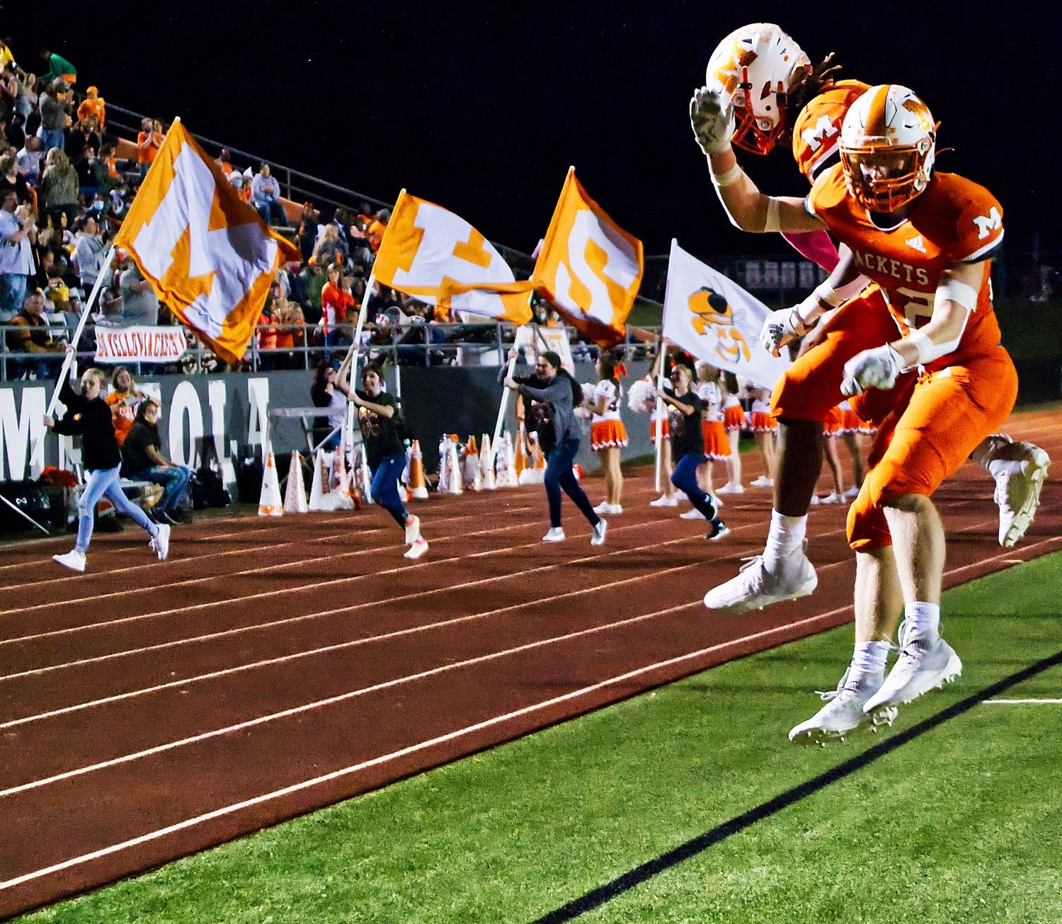 The Mineola backfield running duo of Trevion Sneed and Dawson Pendergrass celebrate a touchdown, a common sight during this homecoming game against Bonham. The Yellowjackets claimed a season title in one of Texas’ toughest districts, losing games to only Mt. Vernon.